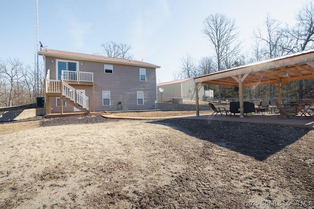 back of house with a patio