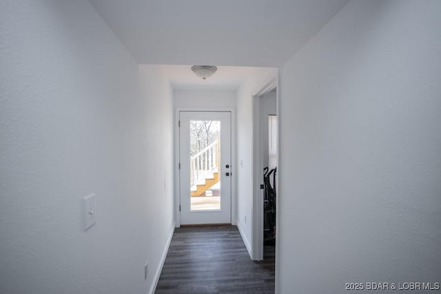 entryway with dark hardwood / wood-style floors