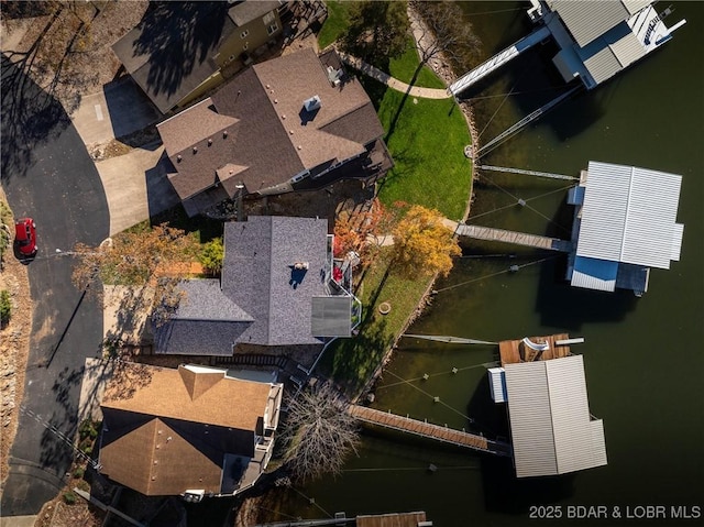 birds eye view of property featuring a water view