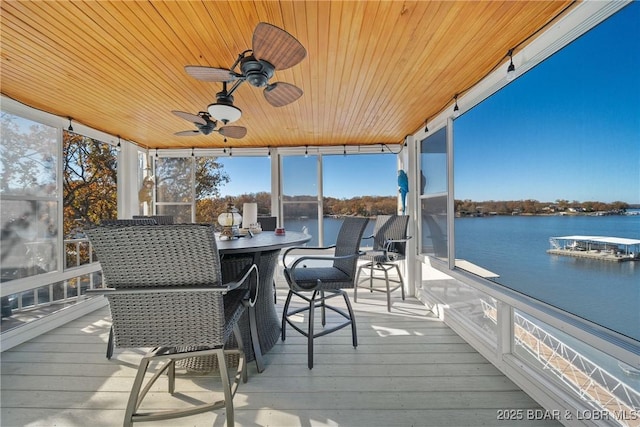 exterior space featuring a water view and ceiling fan