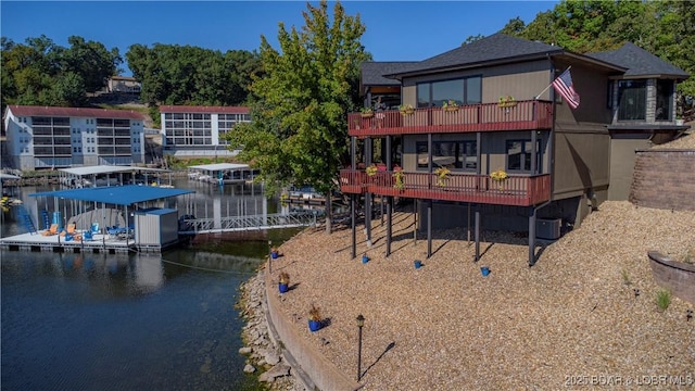 rear view of house with a water view