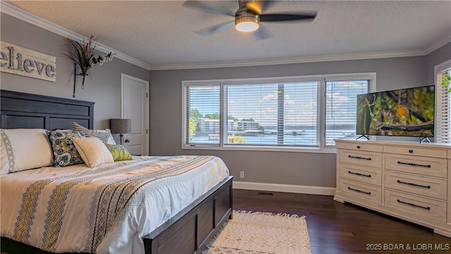 bedroom with ceiling fan, ornamental molding, dark hardwood / wood-style floors, and a textured ceiling