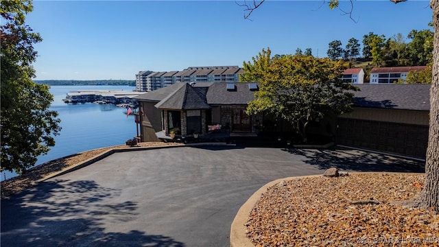 view of front of property with a water view