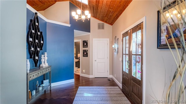 entrance foyer featuring dark hardwood / wood-style floors, wooden ceiling, french doors, and a chandelier