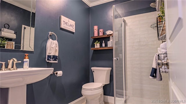 bathroom featuring crown molding, sink, toilet, and walk in shower