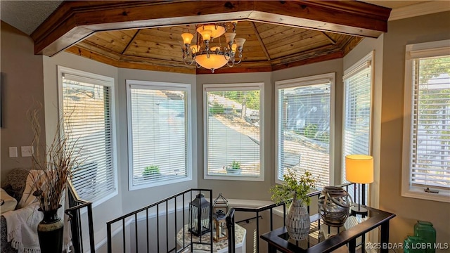 sunroom with a notable chandelier, wooden ceiling, and vaulted ceiling with beams