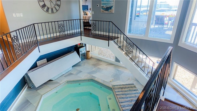 stairway featuring a hot tub