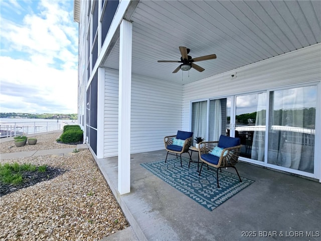 view of patio / terrace featuring ceiling fan and fence