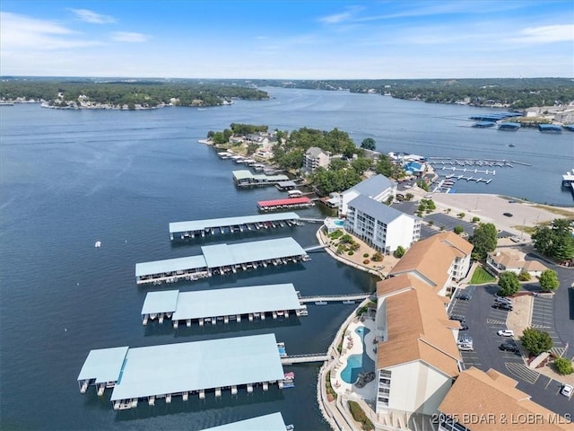 birds eye view of property with a water view