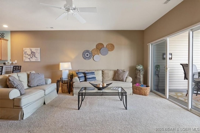 living room with light carpet and ceiling fan