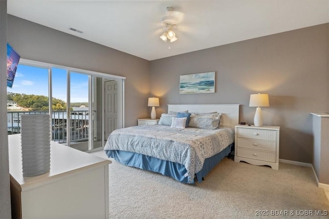 bedroom with ceiling fan, access to exterior, and carpet floors