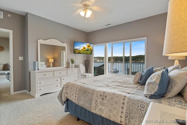 bedroom featuring ceiling fan, carpet, and access to outside