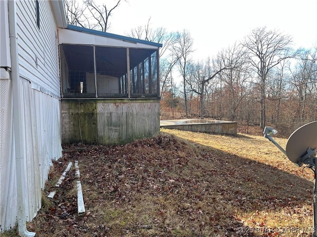 view of yard with a sunroom