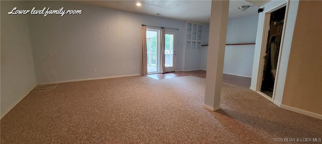 unfurnished room featuring carpet