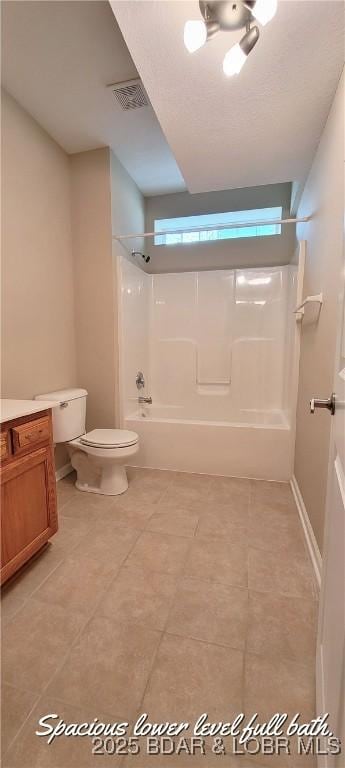 full bathroom with  shower combination, vanity, and toilet