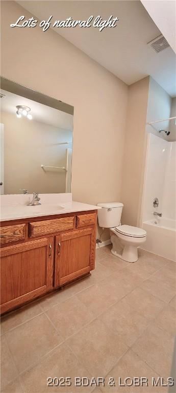 full bathroom featuring tile patterned floors, shower / washtub combination, toilet, and vanity