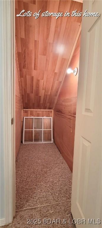 bonus room featuring wood ceiling and vaulted ceiling