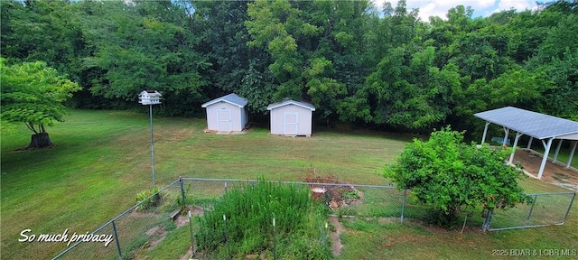 view of yard featuring a carport and a shed