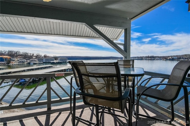 balcony featuring a water view