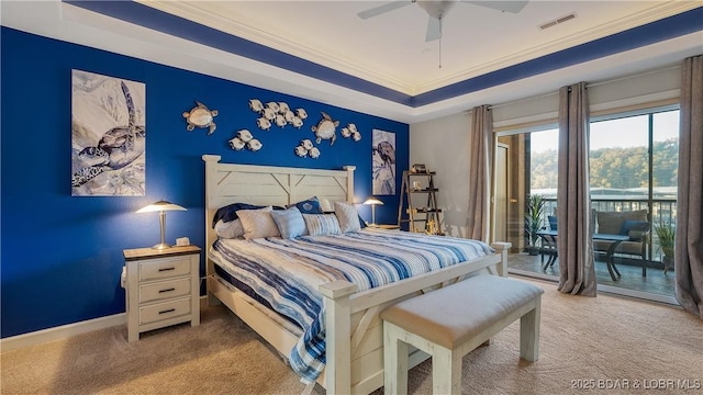 bedroom featuring light carpet, access to outside, ornamental molding, a raised ceiling, and ceiling fan