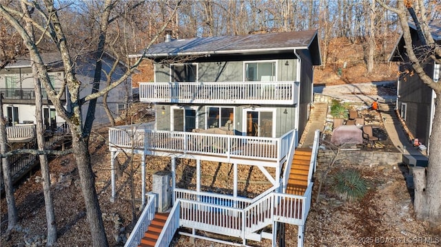 rear view of property with a balcony