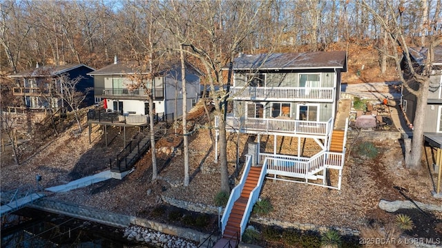 rear view of property with a balcony