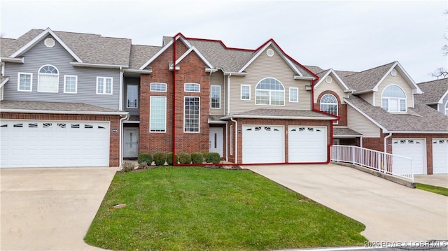 view of front of house with a garage and a front yard