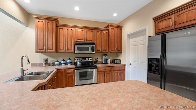 kitchen with appliances with stainless steel finishes and sink