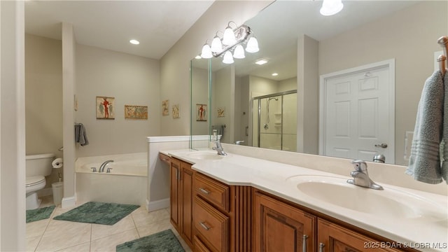 full bathroom featuring tile patterned flooring, vanity, independent shower and bath, and toilet