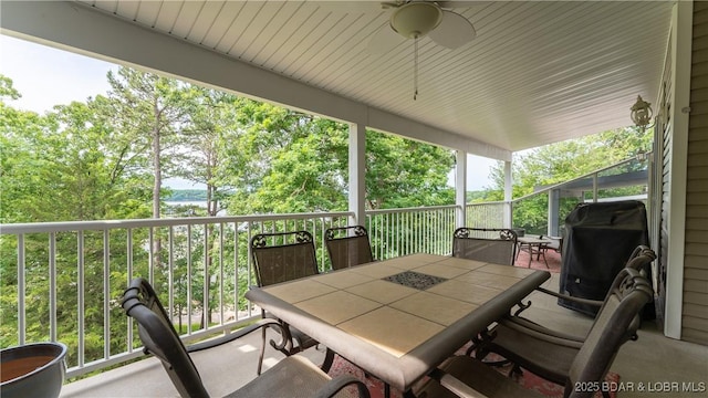 view of patio with ceiling fan and area for grilling