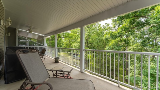 view of patio / terrace featuring ceiling fan and a balcony