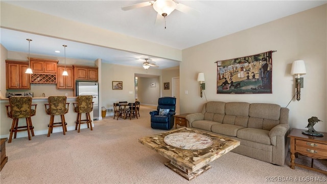 4906 Wilson Dr, Osage Beach, MO 65065 - living area featuring baseboards, light carpet, and a ceiling fan