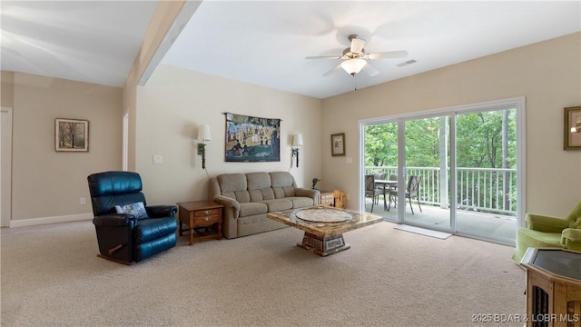 carpeted living room featuring ceiling fan