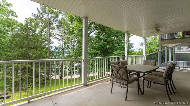 view of patio featuring a balcony and ceiling fan