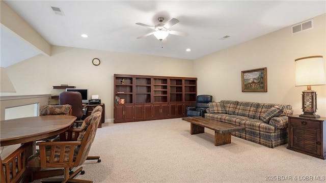 carpeted office featuring ceiling fan and lofted ceiling with beams