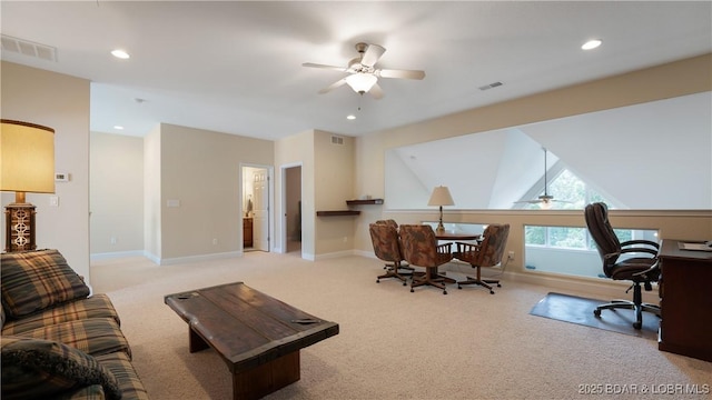 carpeted living room with ceiling fan