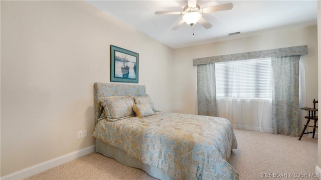 bedroom featuring light colored carpet and ceiling fan