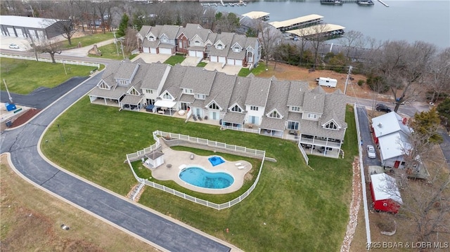 birds eye view of property with a water view