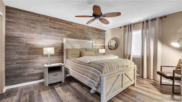 bedroom with wood-type flooring and ceiling fan