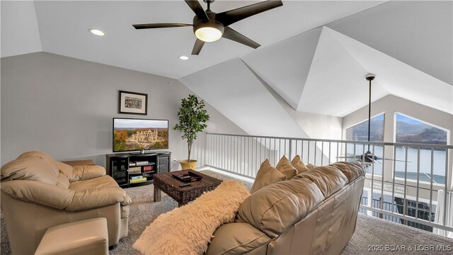 living room with lofted ceiling, carpet, and ceiling fan