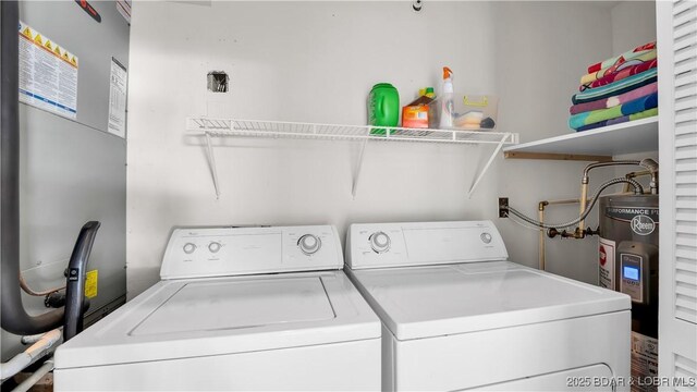 washroom with independent washer and dryer and electric water heater