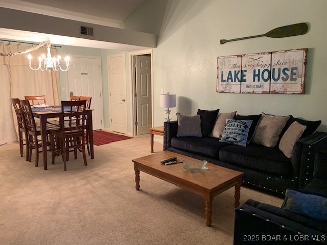 carpeted living room with vaulted ceiling and a chandelier