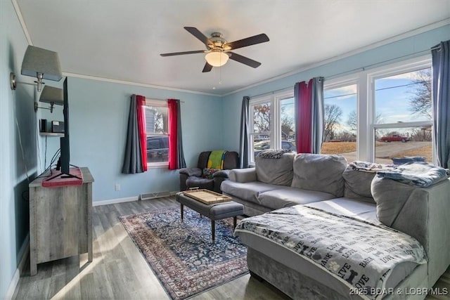 living room with crown molding, ceiling fan, and hardwood / wood-style floors