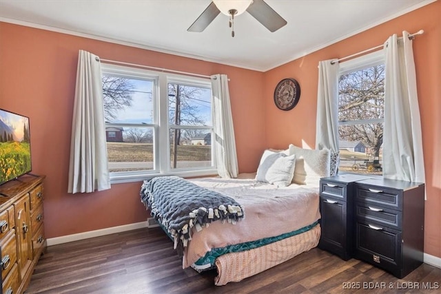 bedroom featuring crown molding, ceiling fan, dark hardwood / wood-style flooring, and multiple windows