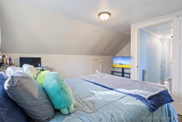 bedroom with vaulted ceiling