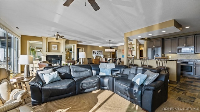 living room featuring ceiling fan