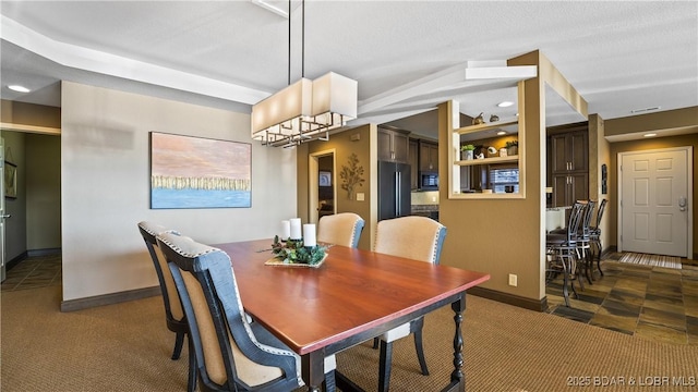 view of carpeted dining area