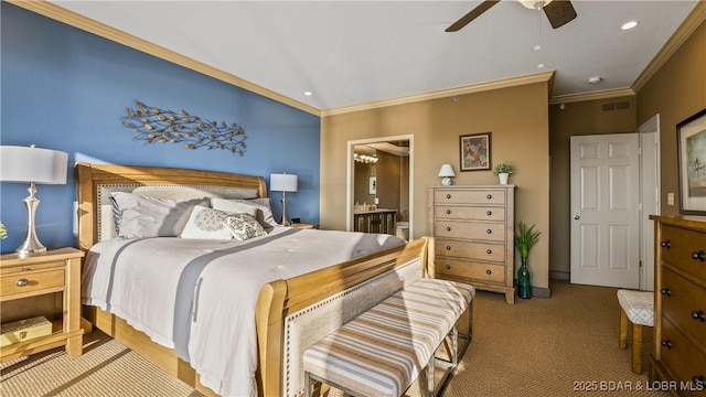 carpeted bedroom featuring crown molding, ensuite bath, and ceiling fan