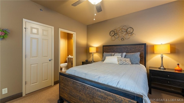 bedroom with light colored carpet, ceiling fan, and ensuite bathroom