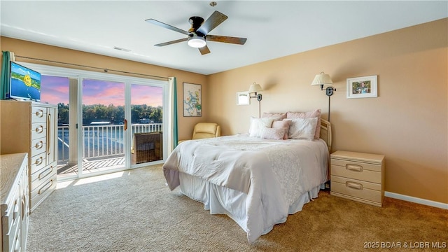 bedroom with baseboards, visible vents, carpet floors, ceiling fan, and access to outside